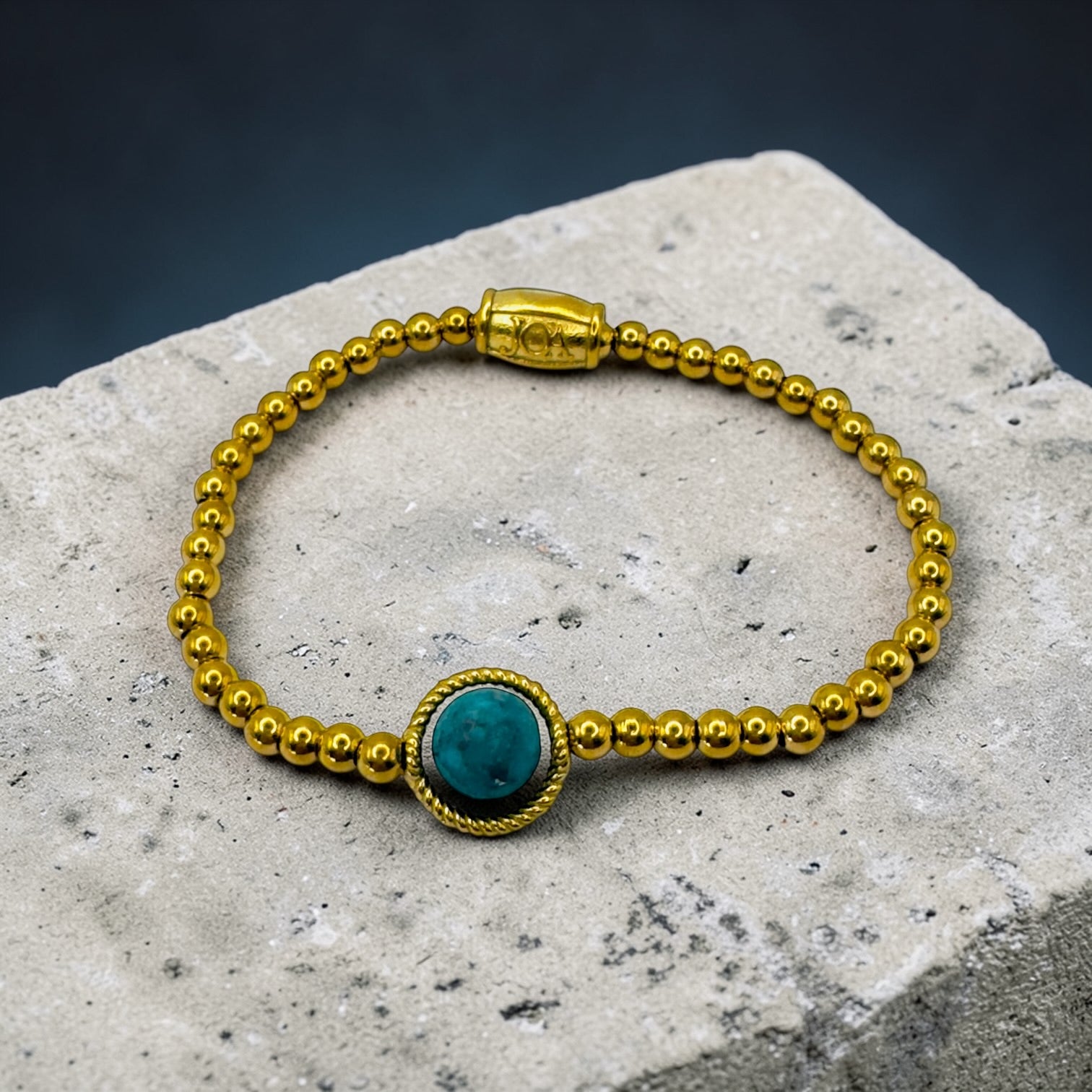 Gouden stainless steel dames armband met turkoois edelsteen